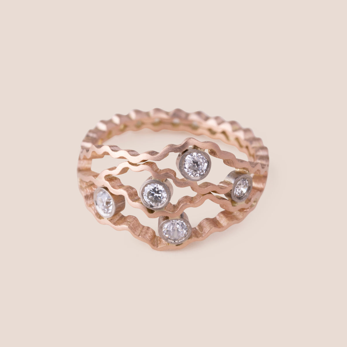 Bespoke Contemporary Rose Gold Ring with 4 wavy layers using clients inherited diamonds